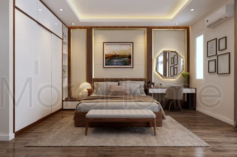 Để làm cho không gian phòng ngủ trở nên ấm cúng hơn, hãy trang trí nhẹ nhàng bằng cách treo bộ tranh và gương trên tường.